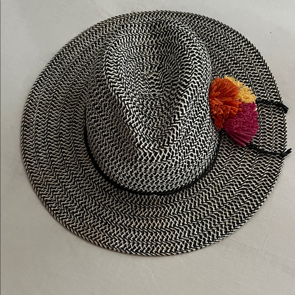 Adorable Straw Hat Black & White with colorful Pom Poms.
Boho Cabo Beach
OS